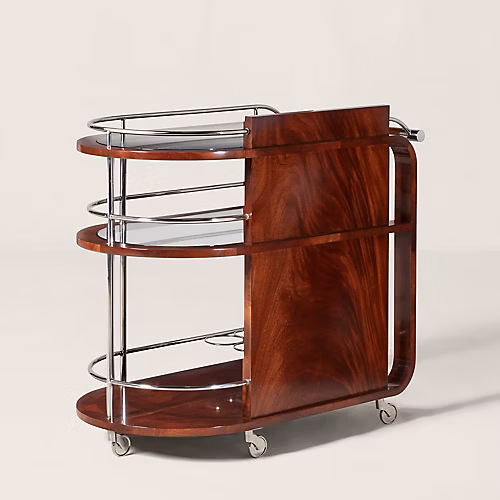 Ralph Lauren Home Duke Bar Cart with polished stainless steel frame, mahogany handle, glass shelves, casters, and bottle storage for a luxury home bar.