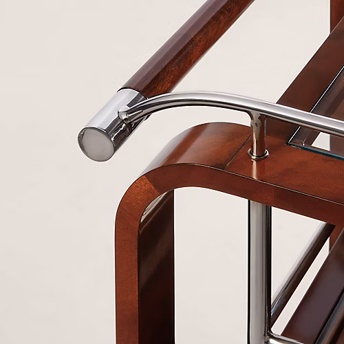 Ralph Lauren Home Duke Bar Cart with polished stainless steel frame, mahogany handle, glass shelves, casters, and bottle storage for a luxury home bar.