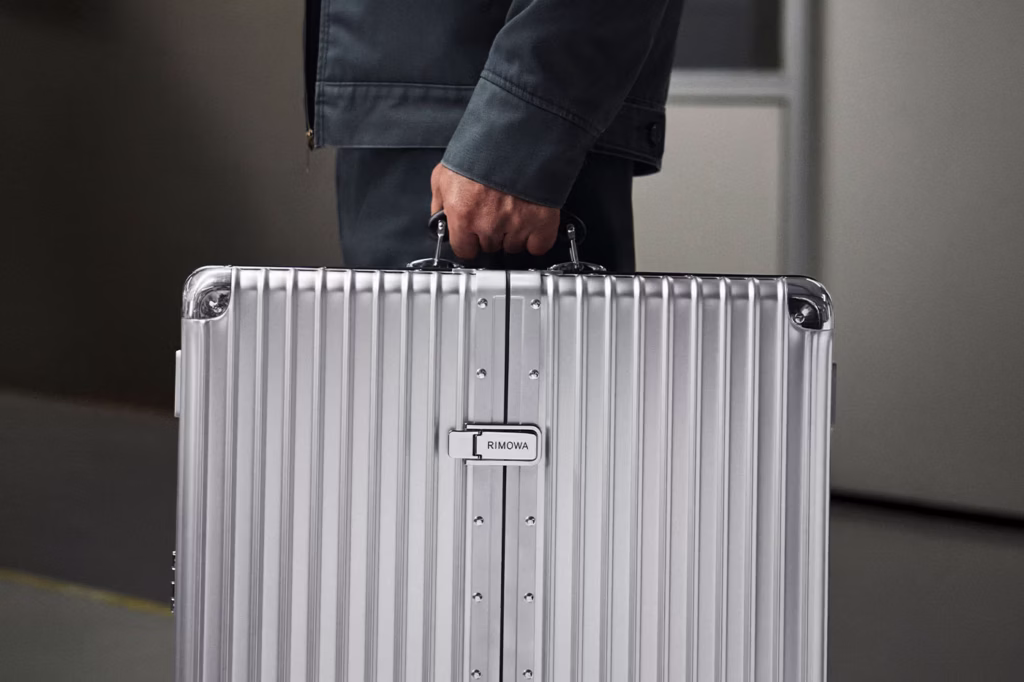 RIMOWA Dartboard Case showcasing the luxury grooved aluminum exterior, premium leather accessories, handcrafted details and portable design during the collaboration with professional darts brand Winmau.