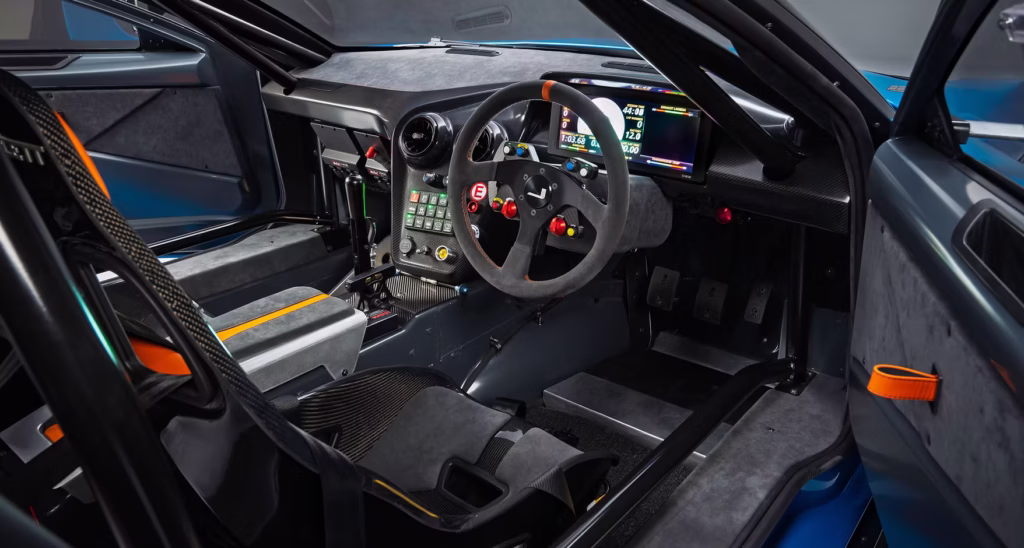 Jensen Interceptor GTX engine bay showing the supercharged V8, carbon-fiber components and chassis bracing.