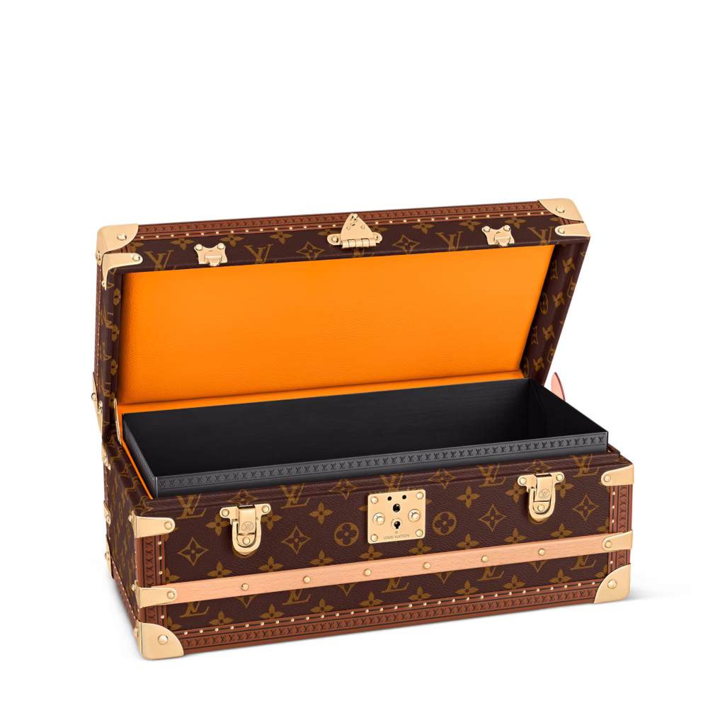Louis Vuitton champagne trunk in Monogram canvas, shown in product views with orange interior, removable inserts and champagne bottle storage.