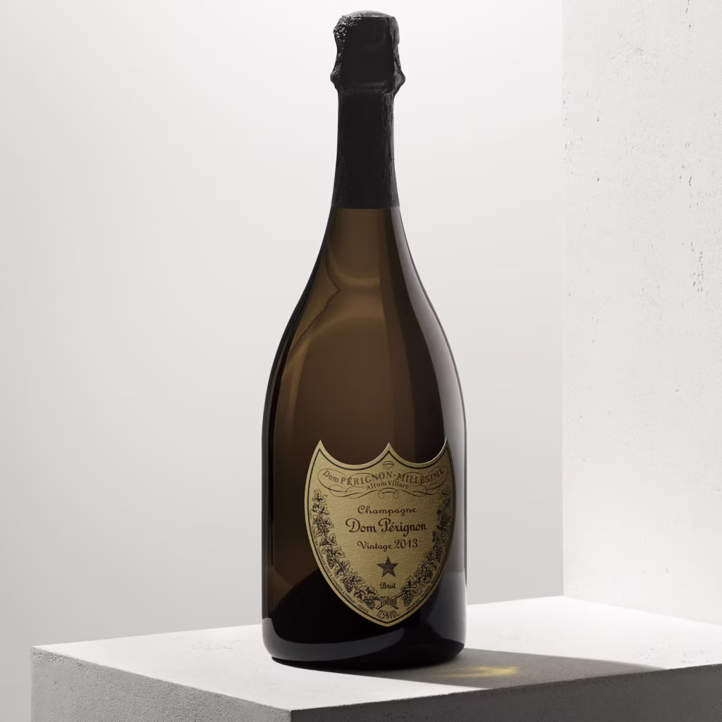 Dom Pérignon Vintage 2013 Champagne bottle displayed on a white pedestal