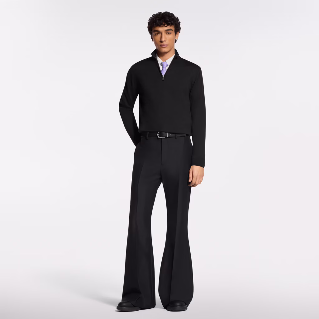 Louis Vuitton model wearing a black formal half-zip sweater with tailored trousers and lavender tie